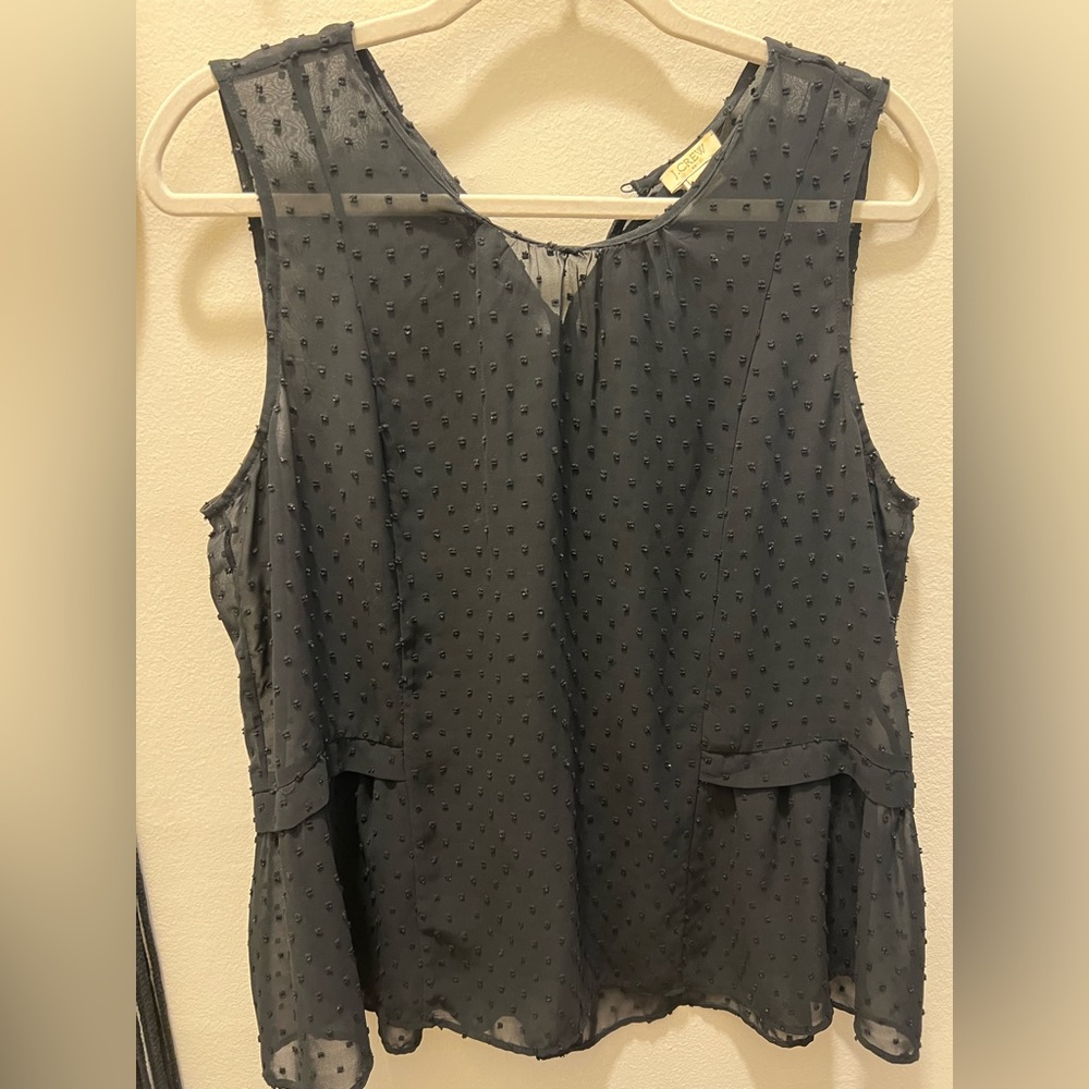 Black polka dot sleeveless blouse with cute side detail